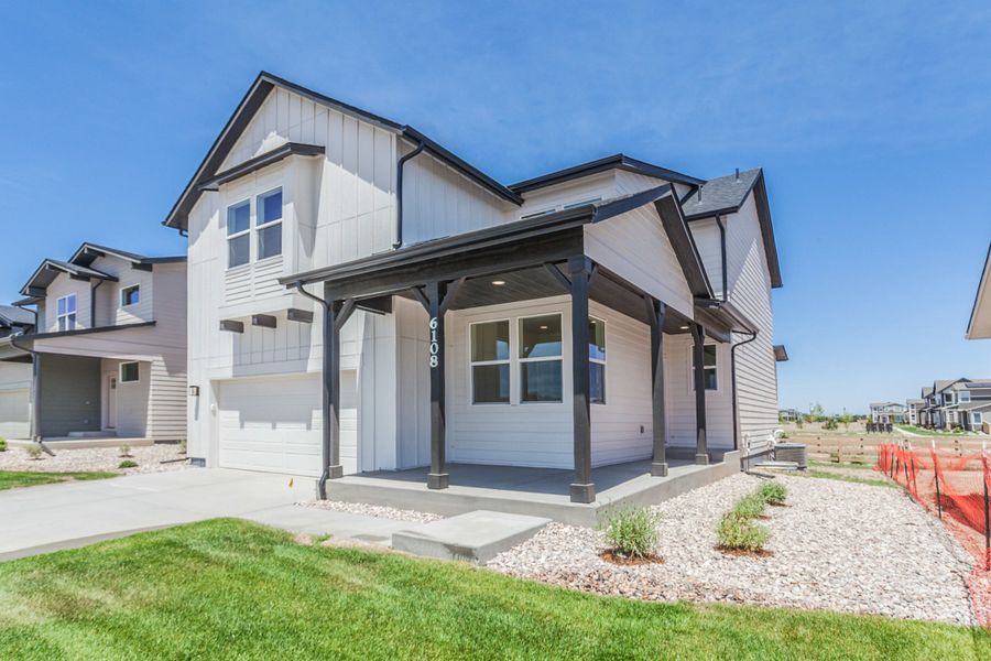 Front exterior of a new home in Trailside, Timnath, CO, highlighting curb appeal (Image 22).