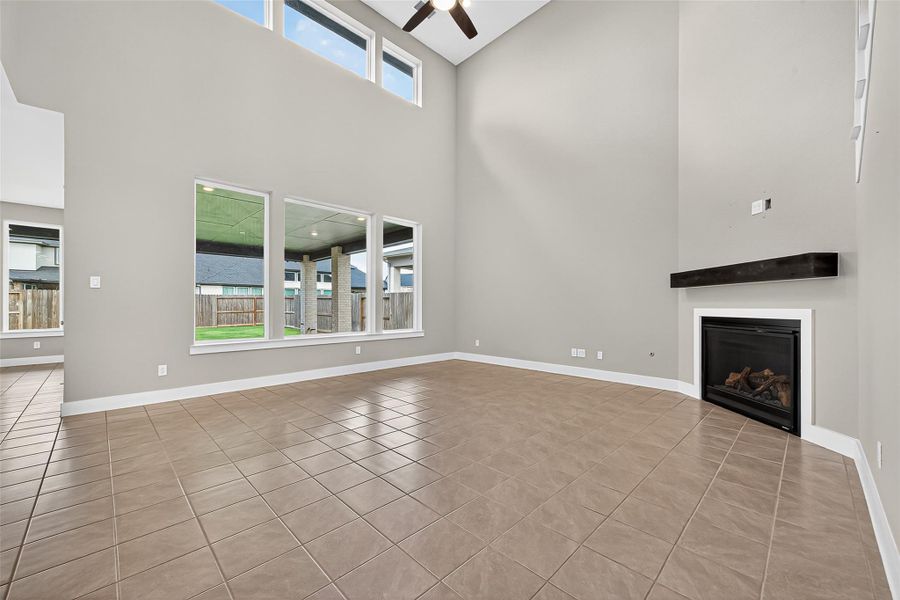 Lots of natural light in the living area with the cozy corner fireplace.