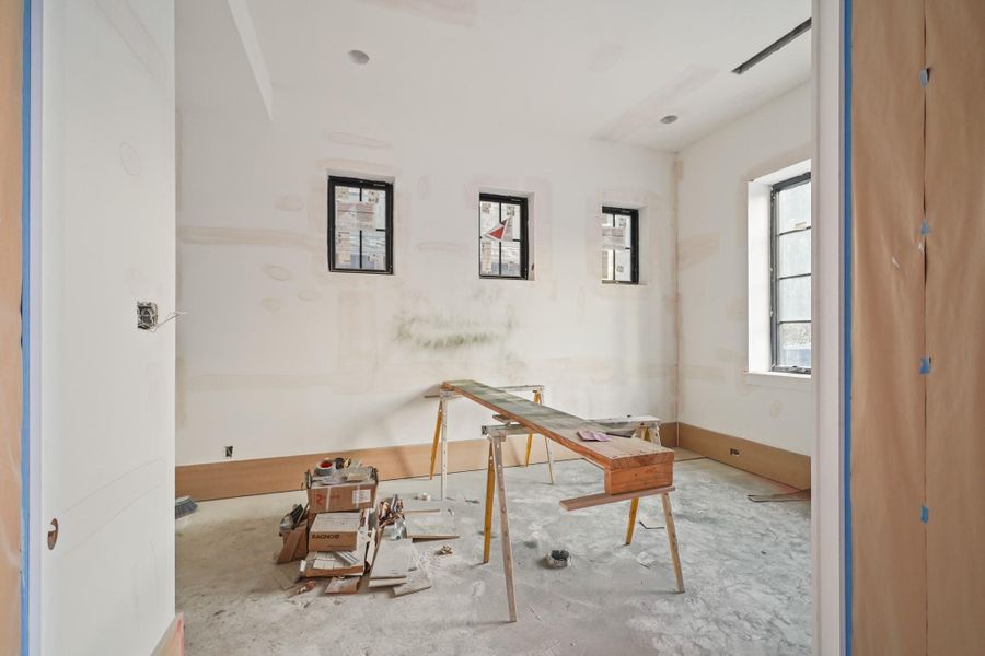 Tucked on the front corner of the home is an office / 5th bedroom!