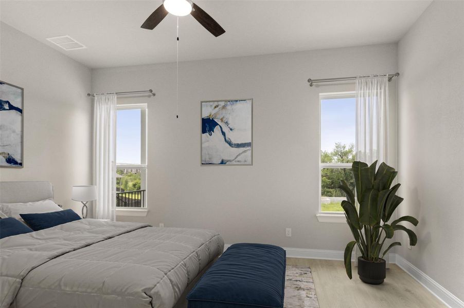 Bedroom featuring wood finished floors, baseboards, and ceiling fan