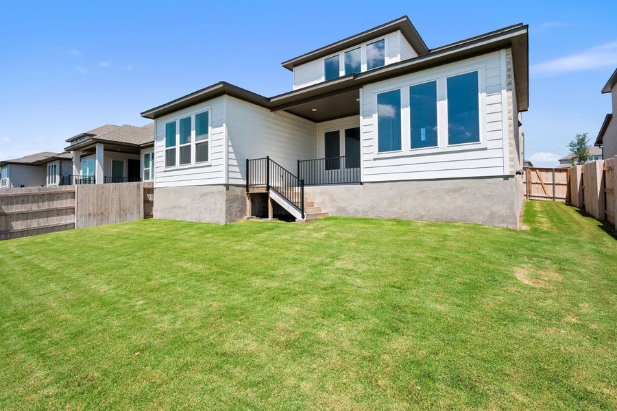 Exterior details and patio area of a home in Lariat, Liberty Hill (Image 28).