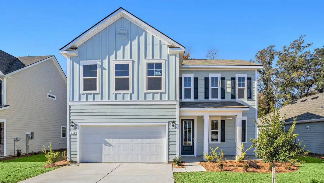 Front exterior of a new home in Riverlake, Supply, NC, highlighting curb appeal (Image 2). Front exterior of a new home in Riverlake, Supply, NC, highlighting curb appeal (Image 2).