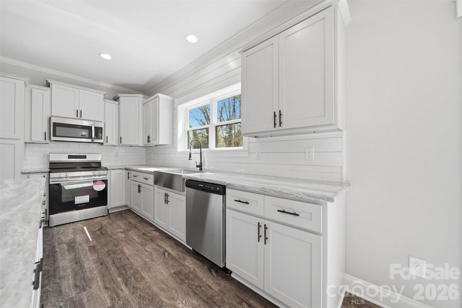 Furnished interior view inside a new home in , Lenoir (Image 10).