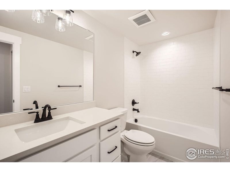 Furnished interior view inside a new home in RainDance National 60/70, Windsor (Image 9).