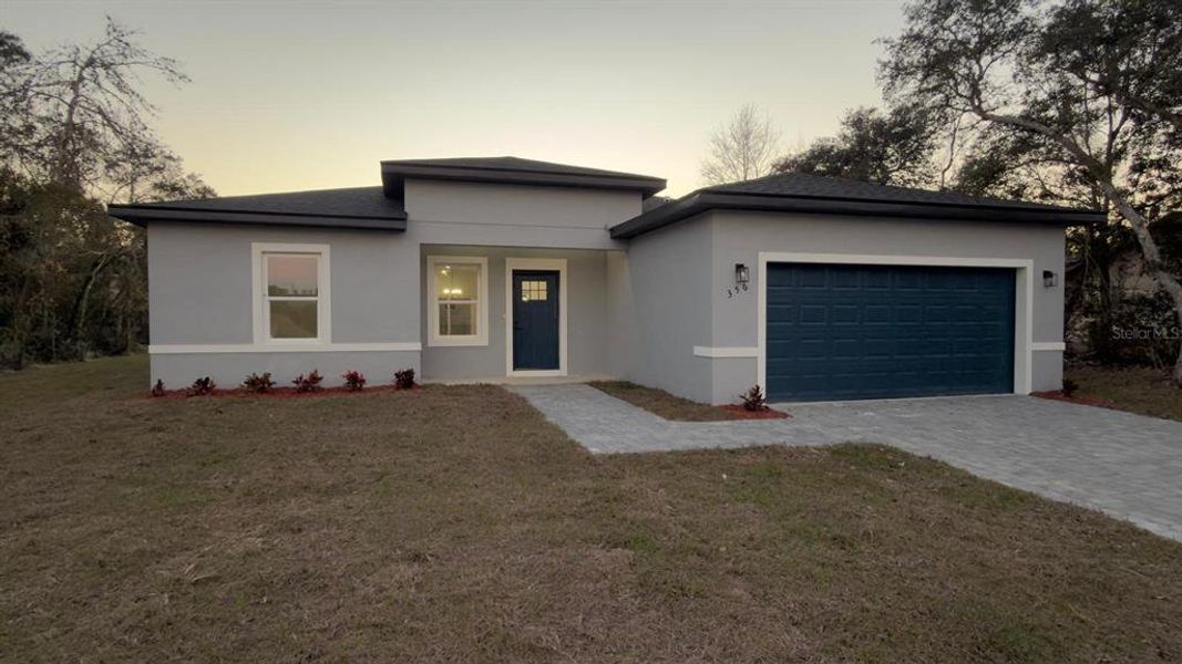 Front exterior of a new home in , Ocala, FL, highlighting curb appeal (Image 14).