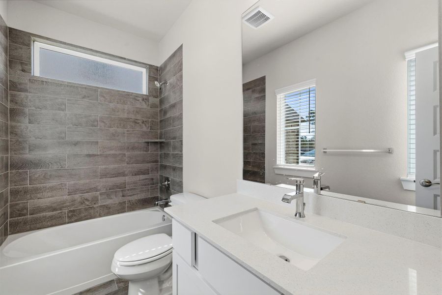 Furnished interior view inside a new home in Barton Creek Ranch, Conroe (Image 6).