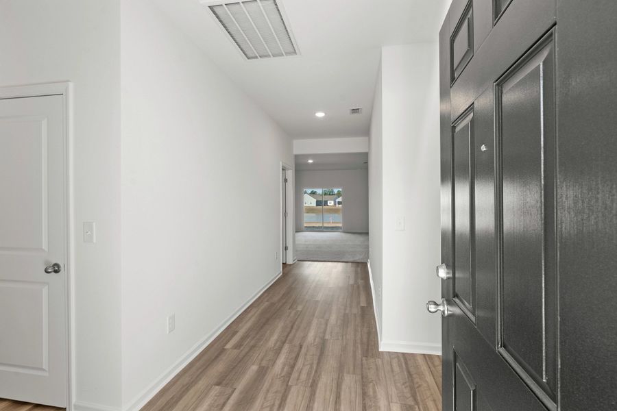 Representative unfurnished interior of a home built from the Europa by Starlight Homes in Oakfield Lakes, Parrish (Image 15).