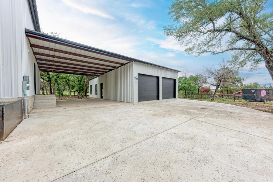 Front exterior of a new home in , Bertram, TX, highlighting curb appeal (Image 20).