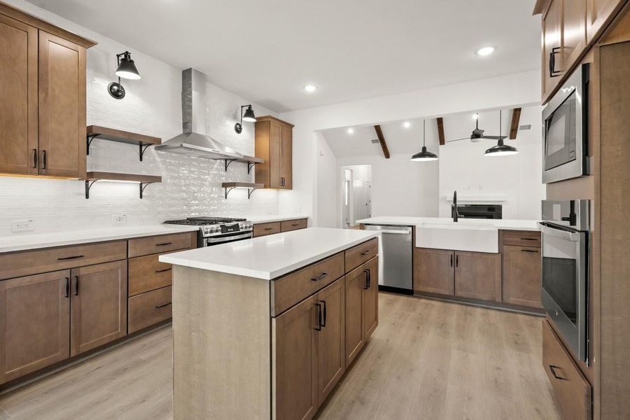 We just love how the kitchen opens to the stunning family room! Gorgeous views!