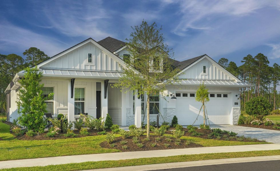 Front exterior of a new home in Plantation Bay, Ormond Beach, FL, highlighting curb appeal (Image 2).