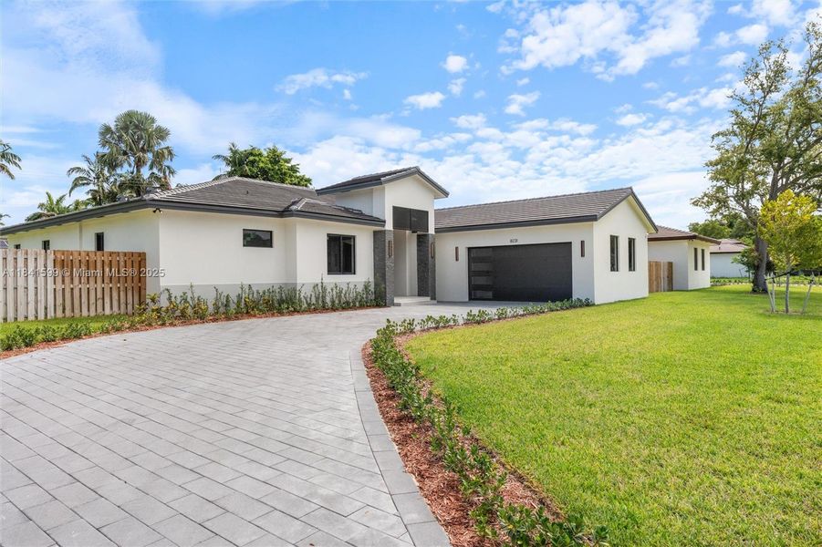 Front exterior of a new home in , Cutler Bay, FL, highlighting curb appeal (Image 24).