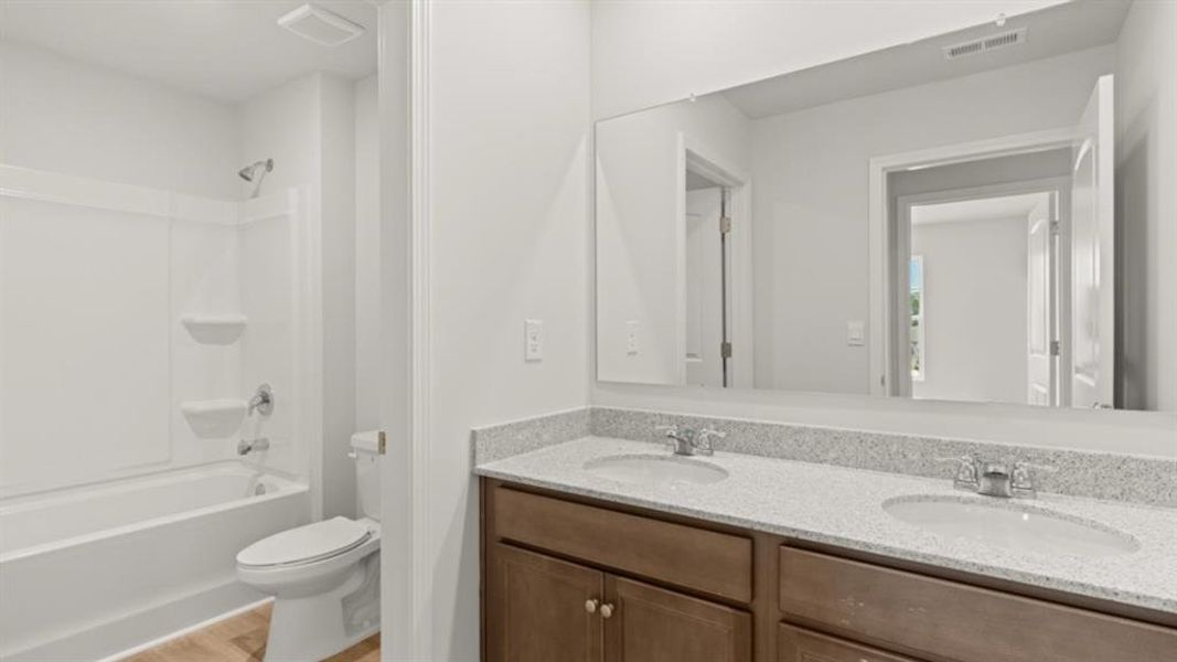 Furnished interior view inside a new home in Fairway 17 at Mirror Lake, Villa Rica (Image 14).