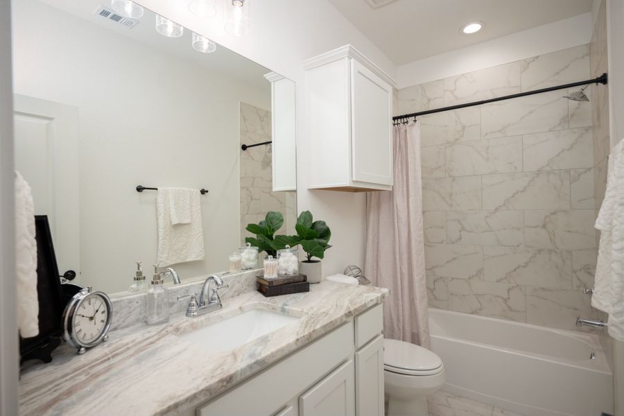 Representative furnished interior of a home built from the The Rose by Avonley Homes in Pinemont, Bryan (Image 32).