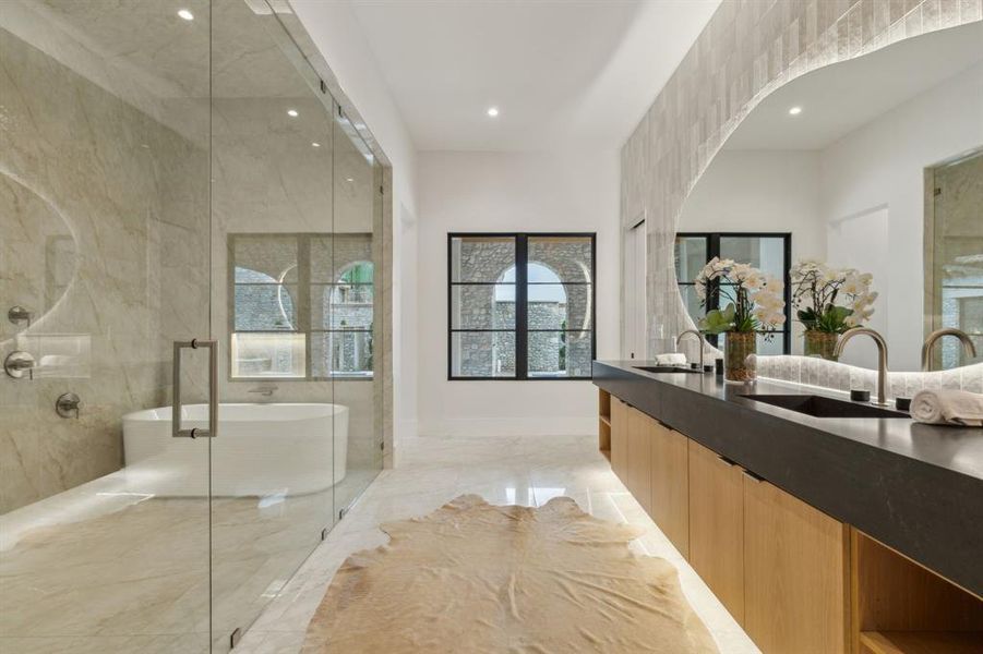 Spacious Bath oasis with designer mirrors and lighting, built-in cabinetry, lighting under cabinetry, duel shower, Hollywood soaking tub, and tile floors Spacious Bath oasis with designer mirrors and lighting, built-in cabinetry, lighting under cabinetry, duel shower, Hollywood soaking tub, and tile floors