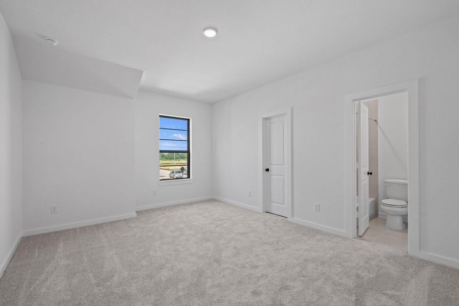 This large bedroom is attached to the private bathroom. This large bedroom is attached to the private bathroom.