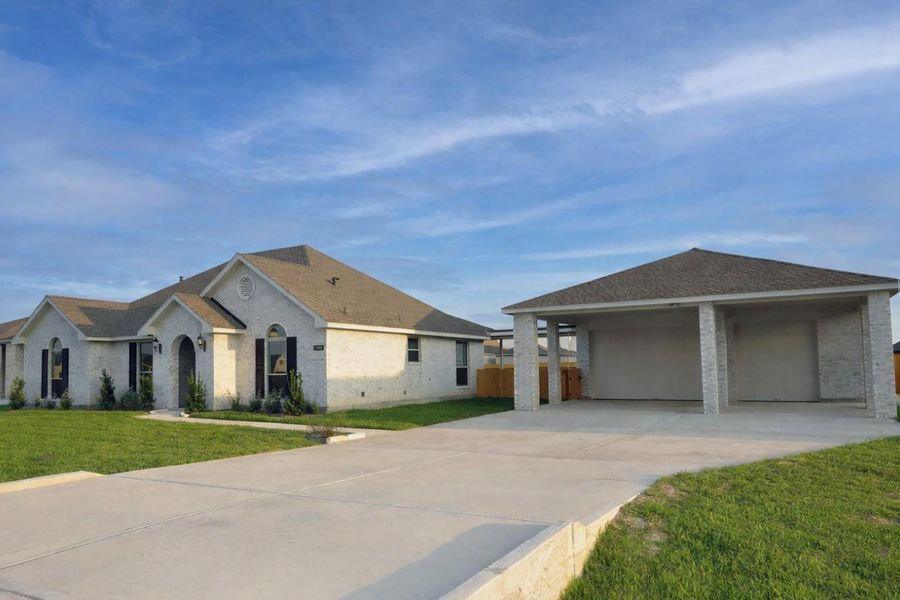 Front exterior of a new home in Pedregal, League City, TX, highlighting curb appeal (Image 1). Front exterior of a new home in Pedregal, League City, TX, highlighting curb appeal (Image 1).