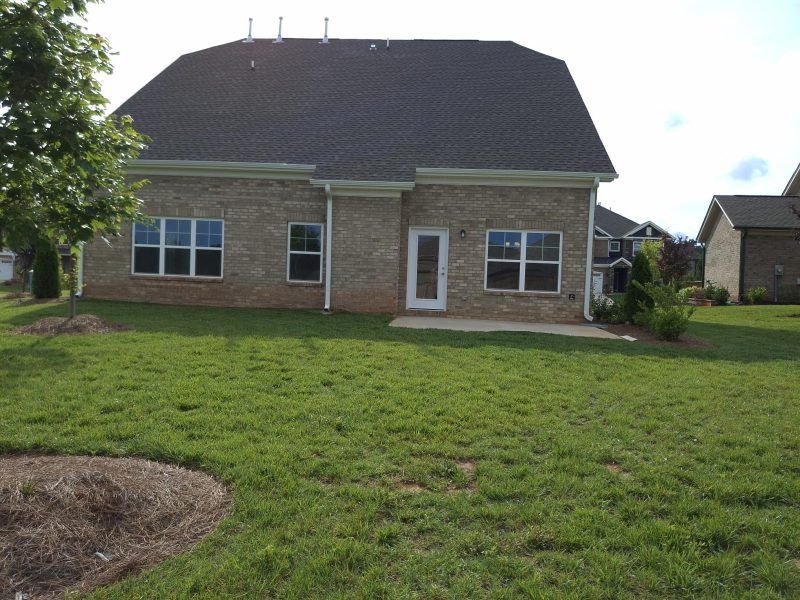 Exterior details and patio area of a home in Weybridge, Burlington (Image 29).