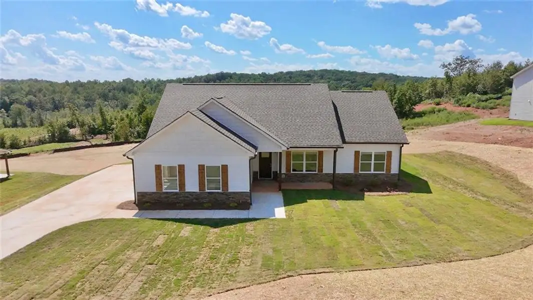 Front exterior of a new home in , Eastanollee, GA, highlighting curb appeal (Image 1). Front exterior of a new home in , Eastanollee, GA, highlighting curb appeal (Image 1).