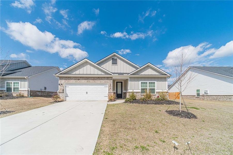 Front exterior of a new home in , Dacula, GA, highlighting curb appeal (Image 22).
