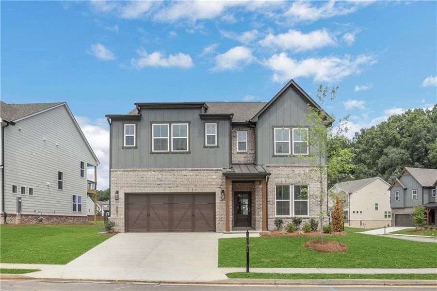 Front exterior of a new home in The Paddocks at Doc Hughes, Buford, GA, highlighting curb appeal (Image 2).