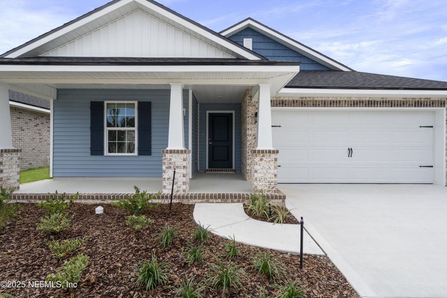 Front exterior of a new home in Shadow Crest at Rolling Hills, Green Cove Springs, FL, highlighting curb appeal (Image 18). Front exterior of a new home in Shadow Crest at Rolling Hills, Green Cove Springs, FL, highlighting curb appeal (Image 18).