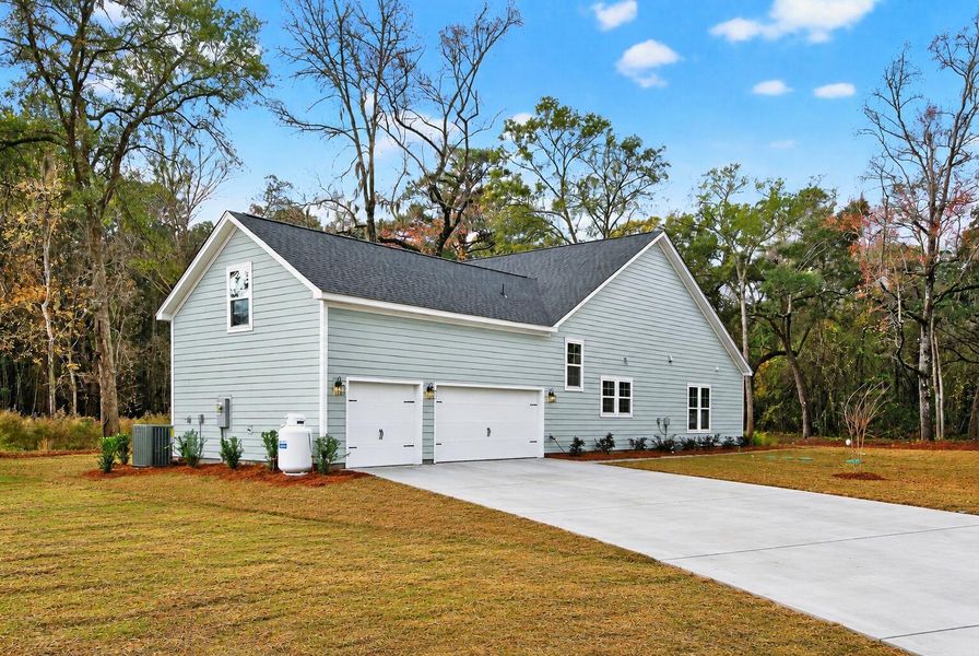 Front exterior of a new home in Charleston County Homes, Charleston, SC, highlighting curb appeal (Image 2). Front exterior of a new home in Charleston County Homes, Charleston, SC, highlighting curb appeal (Image 2).