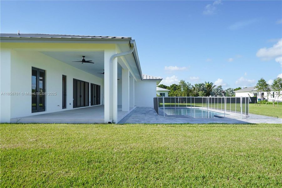 Front exterior of a new home in , Homestead, FL, highlighting curb appeal (Image 1).