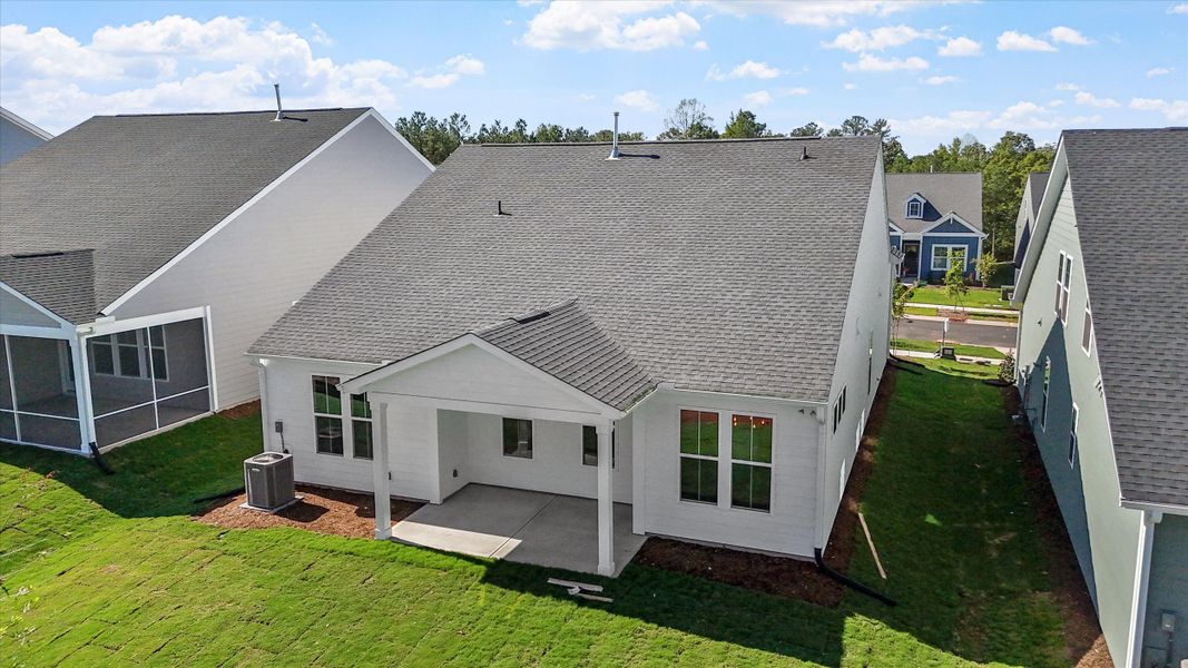 Exterior details and patio area of a home in Ovation at Sweetbrier, Durham (Image 20).