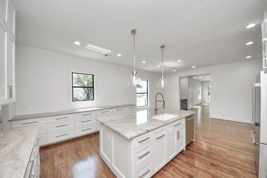 Designed for both everyday ease and entertaining, this kitchen offers an abundance of storage with custom cabinetry that wraps around the space—perfect for keeping everything organized and out of sight. The oversized island not only provides extra prep space, but also serves as the ideal gathering spot for casual meals, cocktails, or hosting friends during a party Designed for both everyday ease and entertaining, this kitchen offers an abundance of storage with custom cabinetry that wraps around the space—perfect for keeping everything organized and out of sight. The oversized island not only provides extra prep space, but also serves as the ideal gathering spot for casual meals, cocktails, or hosting friends during a party
