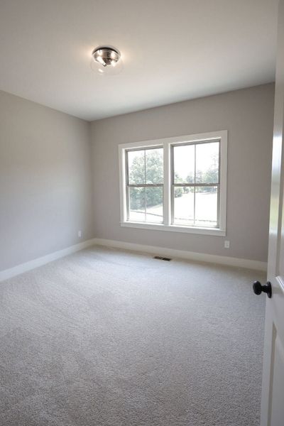 Spacious, unfurnished interior of a new home in Baker Road, Birchwood (Image 24).