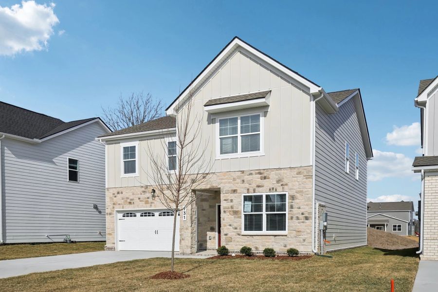 Front exterior of a new home in Ascent at Arbor Ridge, La Vergne, TN, highlighting curb appeal (Image 22). Front exterior of a new home in Ascent at Arbor Ridge, La Vergne, TN, highlighting curb appeal (Image 22).