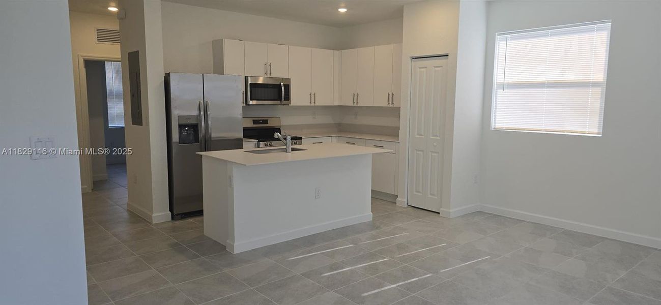 Furnished interior view inside a new home in Le Jardine, Florida City (Image 8).