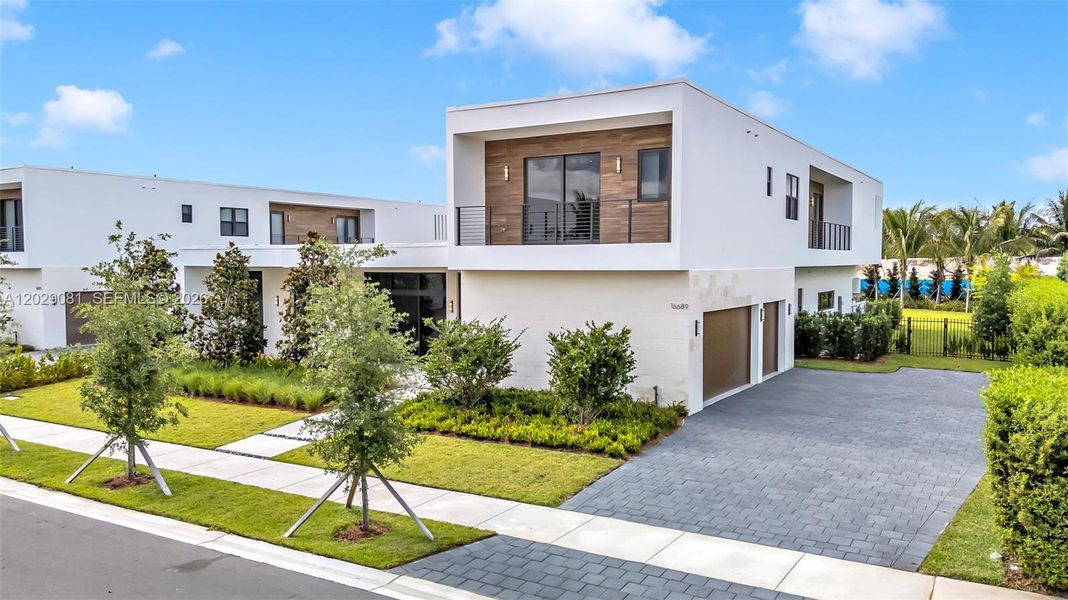 Front exterior of a new home in , Weston, FL, highlighting curb appeal (Image 21).