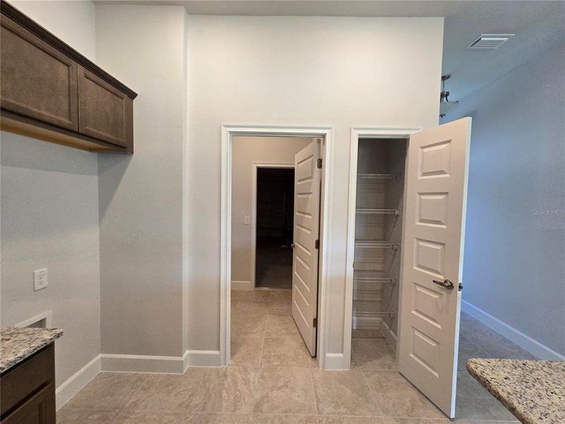 view from kitchen to garage and pantry