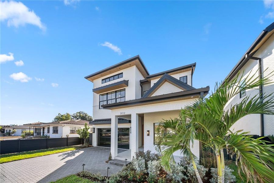 Front exterior of a new home in , Tampa, FL, highlighting curb appeal (Image 2).