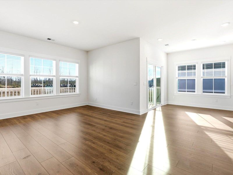 Spacious, unfurnished interior of a new home in The Coves at Lakes of Cane Bay, Summerville (Image 13).