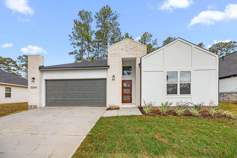 Front exterior of a new home in , Conroe, TX, highlighting curb appeal (Image 25). Front exterior of a new home in , Conroe, TX, highlighting curb appeal (Image 25).