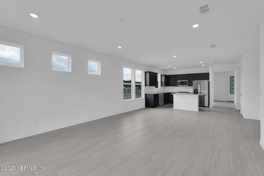 Spacious, unfurnished interior of a new home in Del Webb Wildlight, Yulee (Image 28).