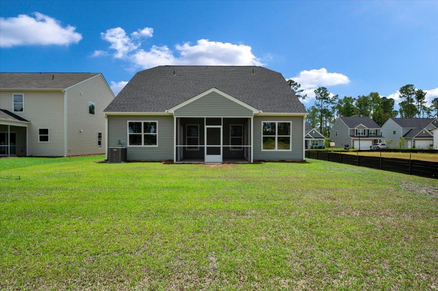 Front exterior of a new home in Parker's Preserve, Ridgeville, SC, highlighting curb appeal (Image 21). Front exterior of a new home in Parker's Preserve, Ridgeville, SC, highlighting curb appeal (Image 21).
