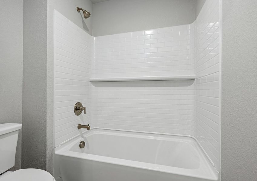 The secondary bathroom has a shower-tub combo.
