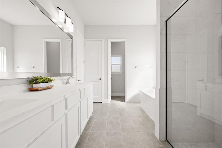 Bathroom with independent shower and bath, vanity, and tile patterned floors