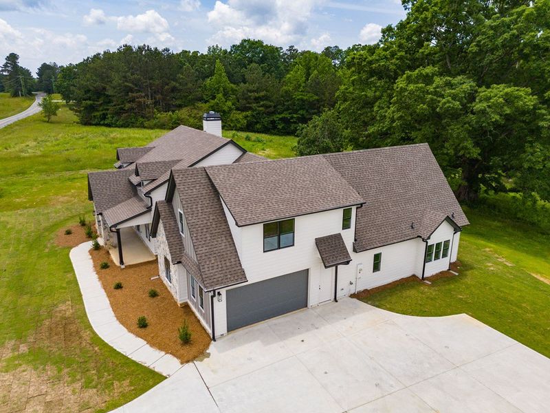 Front exterior of a new home in The Meadows at Lake Circle, Buchanan, GA, highlighting curb appeal (Image 29).