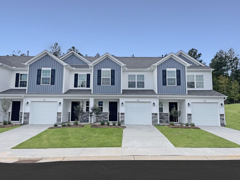 Front exterior of a new home in Springdale Towns, Clinton, SC, highlighting curb appeal (Image 1). Front exterior of a new home in Springdale Towns, Clinton, SC, highlighting curb appeal (Image 1).