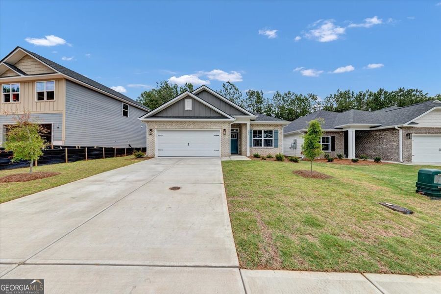 Front exterior of a new home in Canterbury Villas, Carrollton, GA, highlighting curb appeal (Image 20). Front exterior of a new home in Canterbury Villas, Carrollton, GA, highlighting curb appeal (Image 20).
