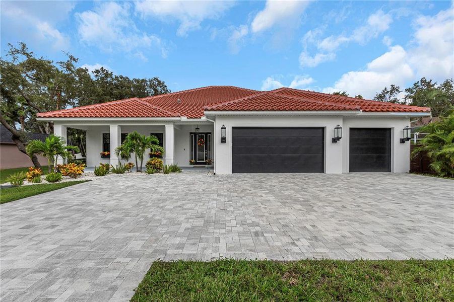 Front exterior of a new home in , Tarpon Springs, FL, highlighting curb appeal (Image 27).