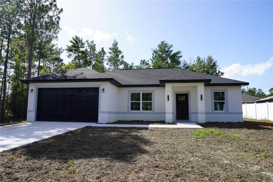 Front exterior of a new home in , Ocala, FL, highlighting curb appeal (Image 1). Front exterior of a new home in , Ocala, FL, highlighting curb appeal (Image 1).