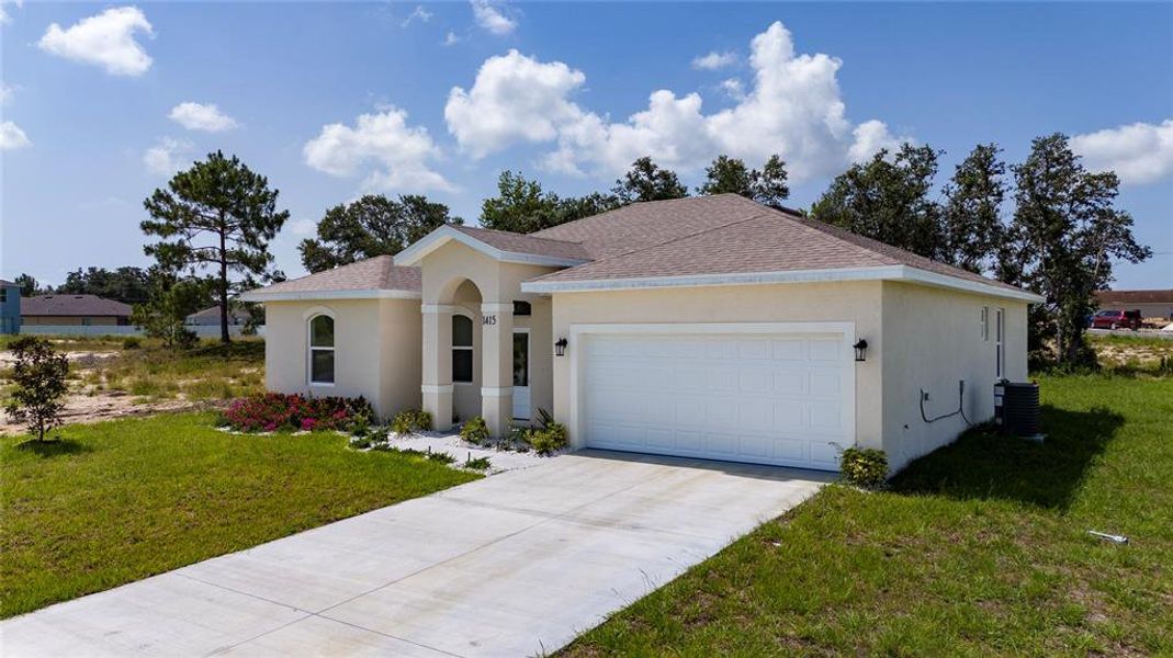 Front exterior of a new home in , Kissimmee, FL, highlighting curb appeal (Image 1).