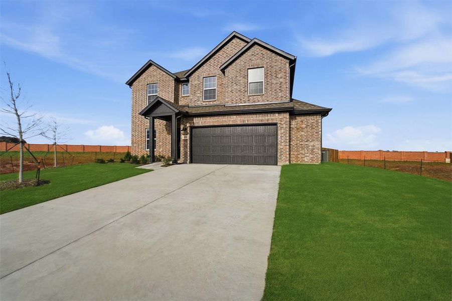 Front exterior of a new home in Saddlebrook Estates, Waxahachie, TX, highlighting curb appeal (Image 1). Front exterior of a new home in Saddlebrook Estates, Waxahachie, TX, highlighting curb appeal (Image 1).