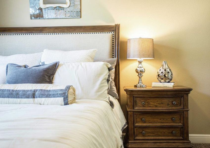 Bedroom with nightstand and lamp.