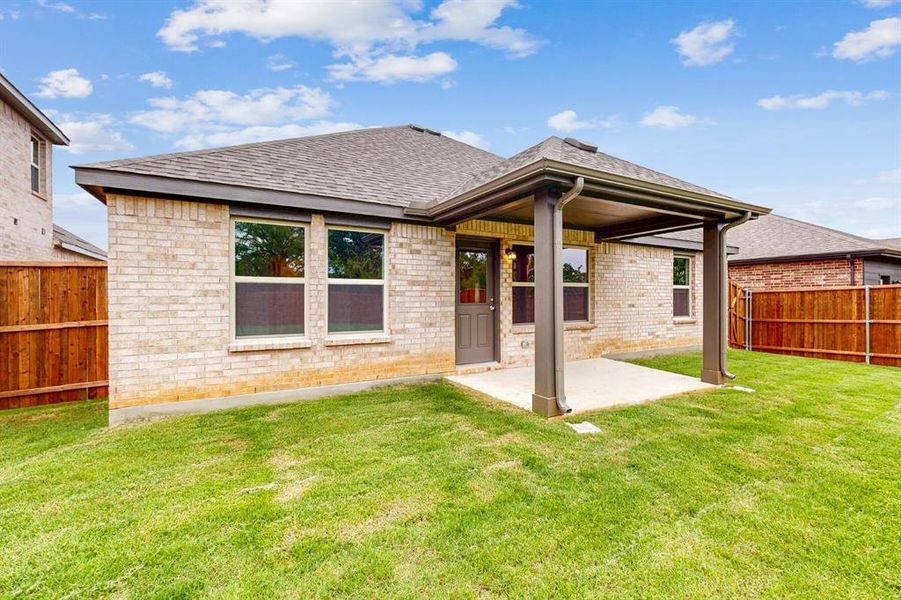 Front exterior of a new home in Kings Way, Denton, TX, highlighting curb appeal (Image 14).